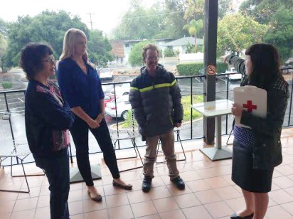 Melissa Durand, Business Operations Coordinator, pointing out our pre-designated gathering spot to volunteers Gayle Robinson and Timmy Kriedman, as well as Major Gifts Officer Kimberley Coley